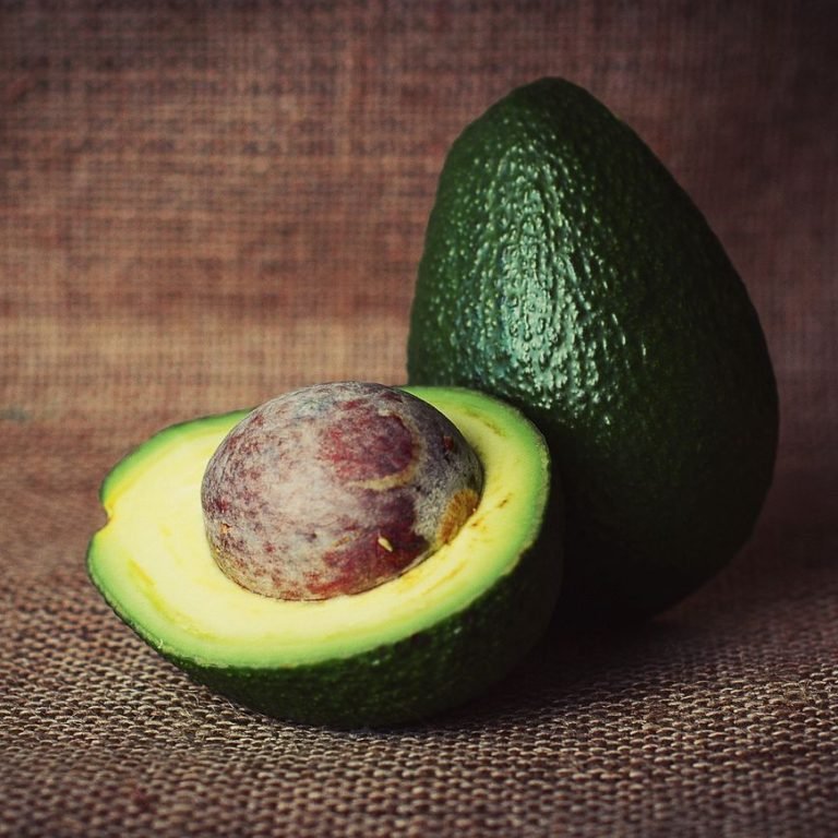 Free fresh avocado cut up on brown